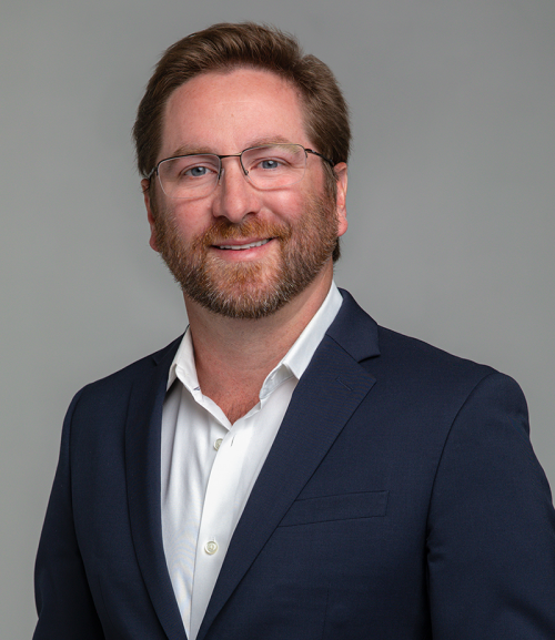 Professional headshot of a businessman in a suit